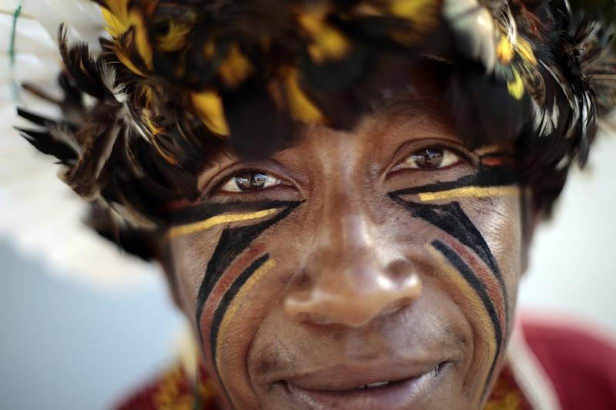 A Pataxo Indian living in Bahia, in northeastern Brazil, is seen near the Esplanade of Ministries in Brasilia March 12, 2014. The Indians are in Brasilia for meetings with authorities to discuss health needs and conflict issues between Indians and farmers