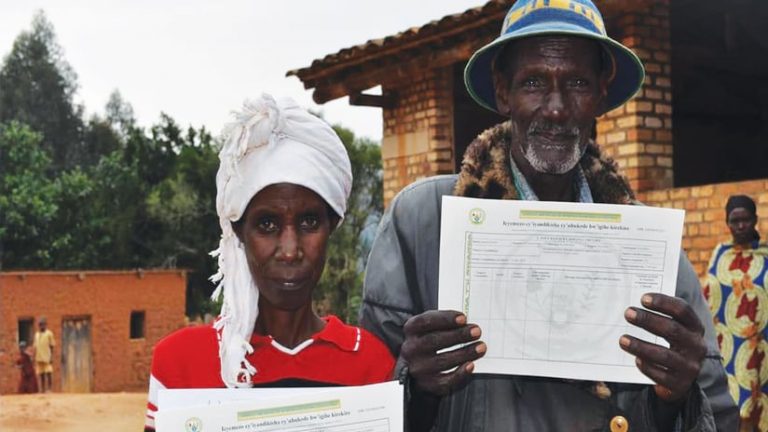 Land rights holders display certificates. Photo ARC news CC BY-NC-ND 2.0