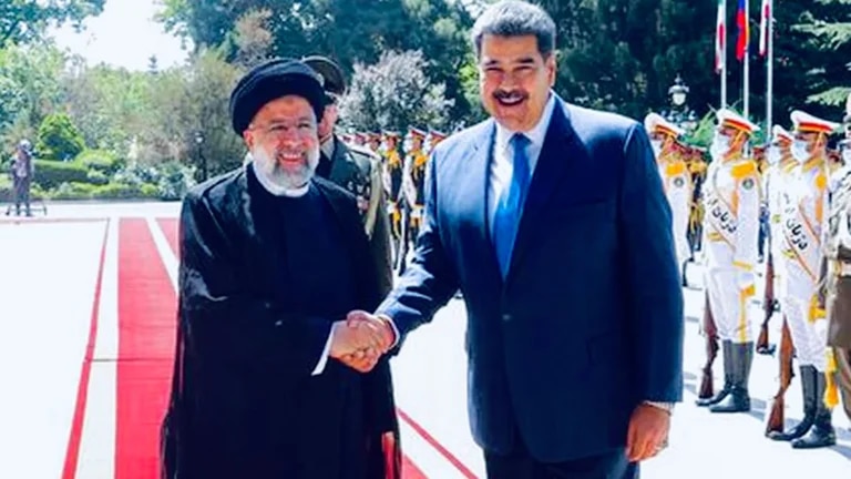 Ebrahim Raisi, Iran's president, greets Nicolas Maduro during his visit to the Islamic country last 