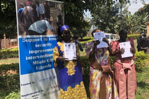 Three of the over 500 Mbale residents who received certificates of customary ownership Photo: ACTogether Uganda